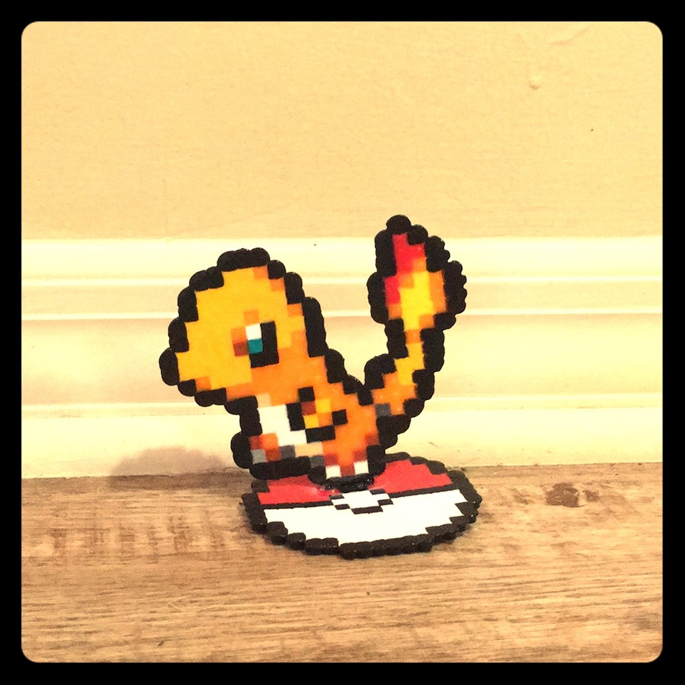 Charmander Pokémon standing on Poké Ball